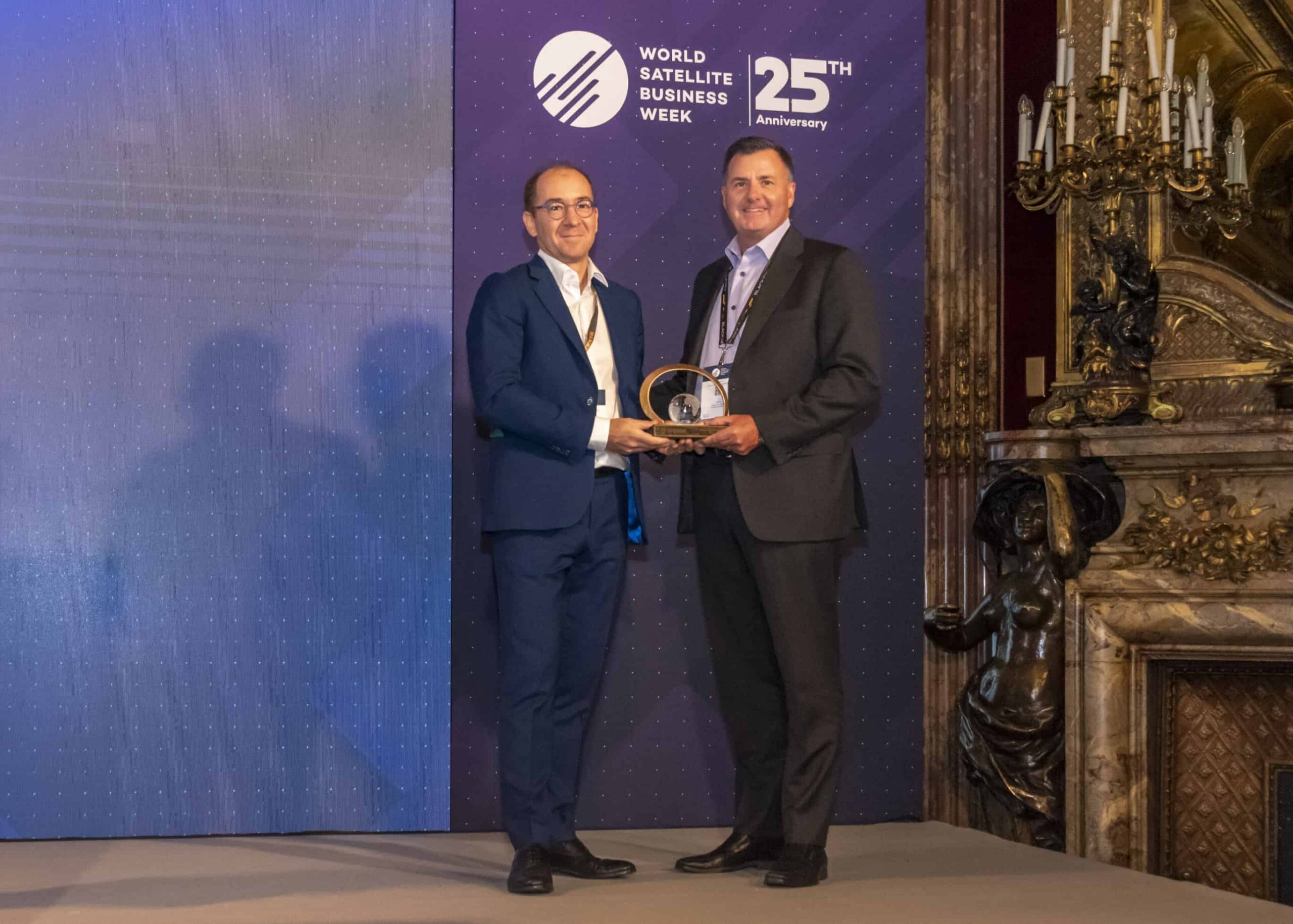 Euroconsult CEO Pacôme Révillon posing with BlackSky CEO Brian O’Toole with the Pioneer in Space Business Award at World Satellite Business Week (WSBW) 2022