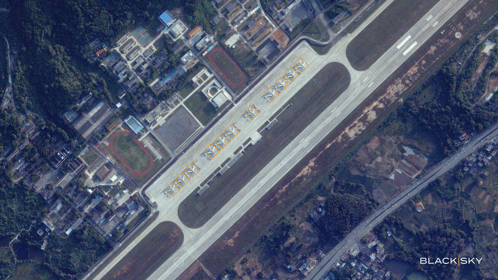 Satellite imagery of Nanning Airfield in China with analytics identifying aircraft.